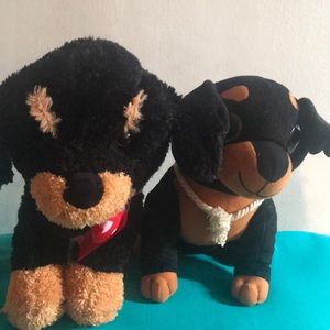 Two Rottweiler stuffed animals